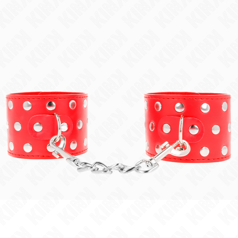 img_189203_3376c5e8d51a232863d59fd06bdb9439_1 KINK - WRIST RESTRAINTS WITH SNAP FASTEN FULL OF RIVETS RED ADJUSTABLE 19-24 CM X 5.5 CM - Image 1