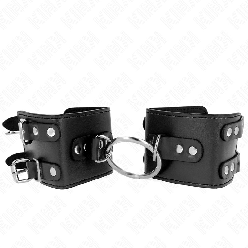img_189307_e617abd63a2939b3d950562ea8178c0c_1 KINK - FIXED WRIST RESTRAINTS WITH RING AND STUDS ADJUSTABLE BLACK 17-22 CM X 6.5 CM - Image 1